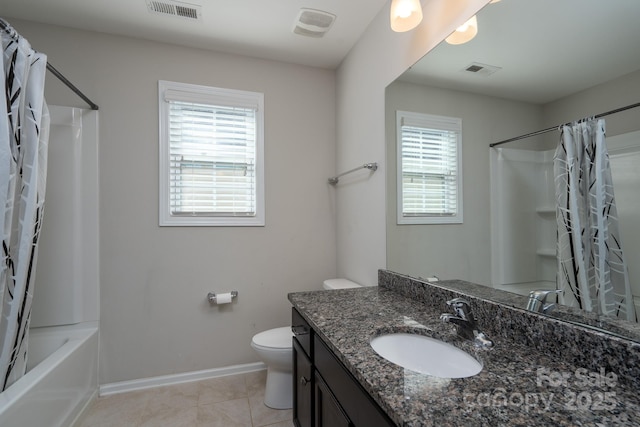 full bathroom with tile patterned floors, vanity, a healthy amount of sunlight, and toilet