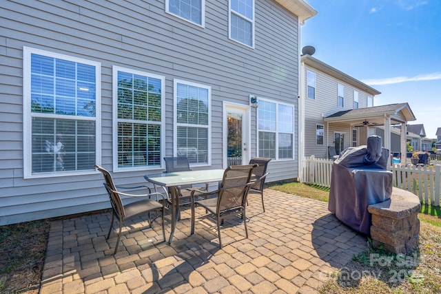 view of patio featuring ceiling fan and a grill