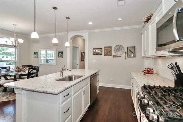 kitchen featuring stainless steel appliances, dark hardwood / wood-style floors, a kitchen island with sink, and sink