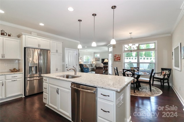 kitchen with decorative light fixtures, appliances with stainless steel finishes, dark hardwood / wood-style floors, and sink