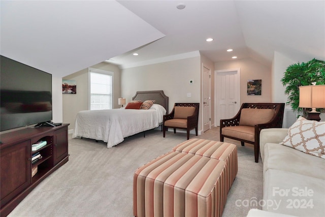 carpeted bedroom featuring vaulted ceiling