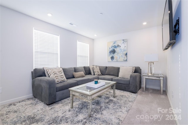 living room featuring light colored carpet