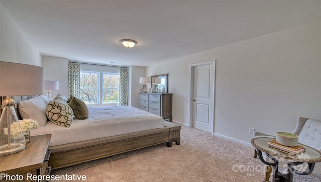 bedroom featuring light carpet