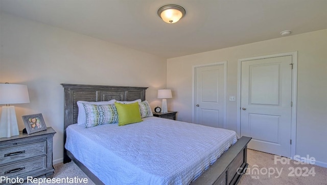 bedroom featuring light colored carpet