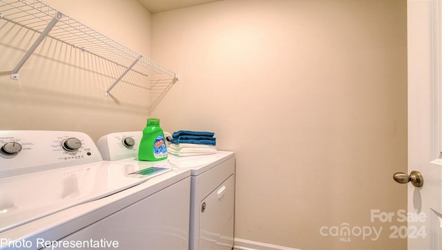 clothes washing area featuring washer and dryer