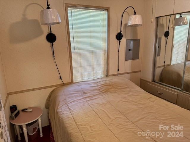 bedroom featuring electric panel