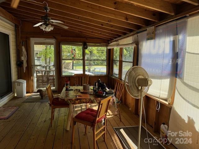 201 Deer Park Rd, Mount Gilead, NC 27306 - sunroom / solarium featuring a ceiling fan, lofted ceiling, hardwood / wood-style floors, wooden walls, and a deck