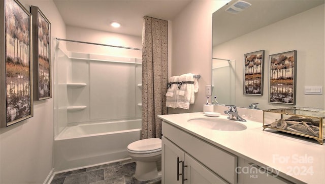 bathroom featuring vanity, toilet, visible vents, stone finish flooring, and shower / bath combination with curtain
