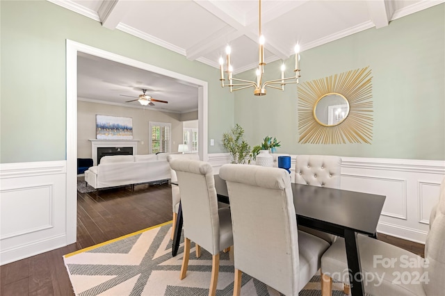 dining area with ceiling fan with notable chandelier, dark hardwood / wood-style floors, beam ceiling, and crown molding