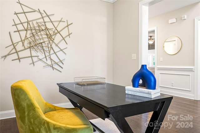 home office with dark hardwood / wood-style floors and crown molding