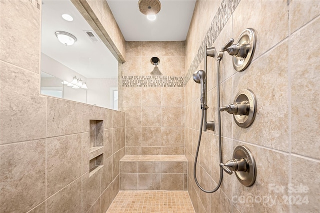 bathroom featuring tiled shower