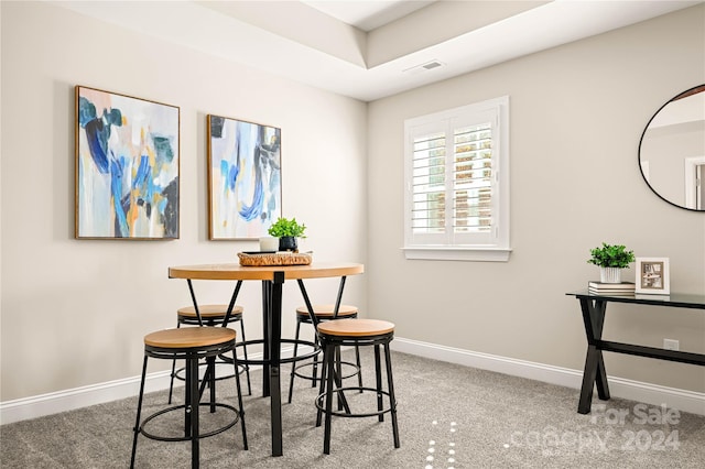 dining room featuring carpet