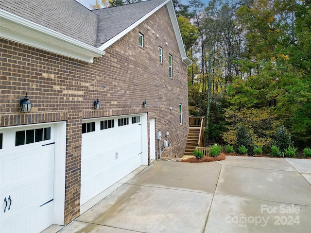 view of side of home with a garage