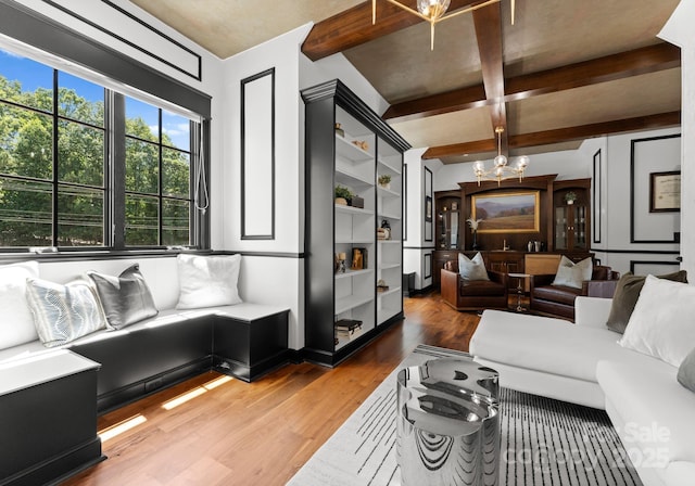 16921 Jetton Rd, Cornelius, NC 28031 - living room with a chandelier, light wood finished floors, and beam ceiling