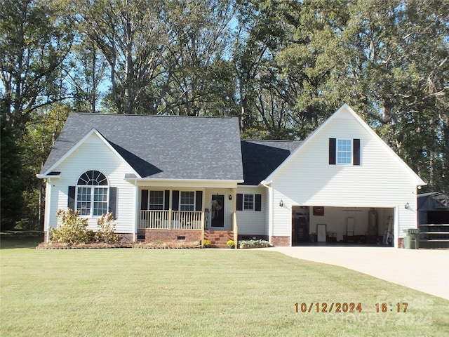 view of front of house with a front yard and a garage