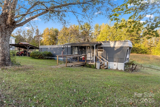 rear view of house with a lawn