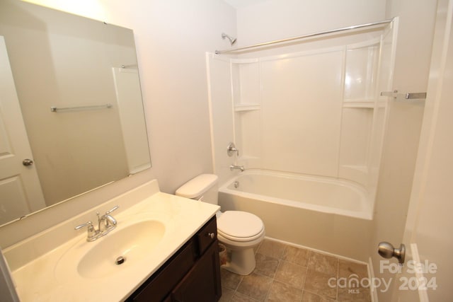 full bathroom with toilet, vanity, and tub / shower combination