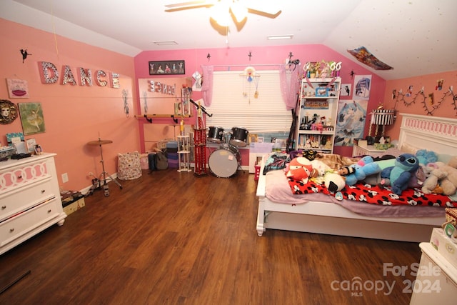 bedroom featuring ceiling fan, dark wood-type flooring, and vaulted ceiling