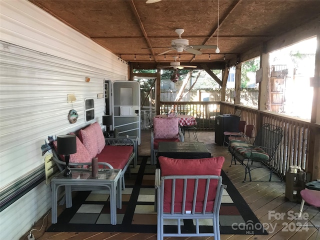 deck with ceiling fan and an outdoor hangout area