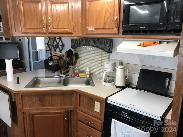 kitchen with sink and black appliances