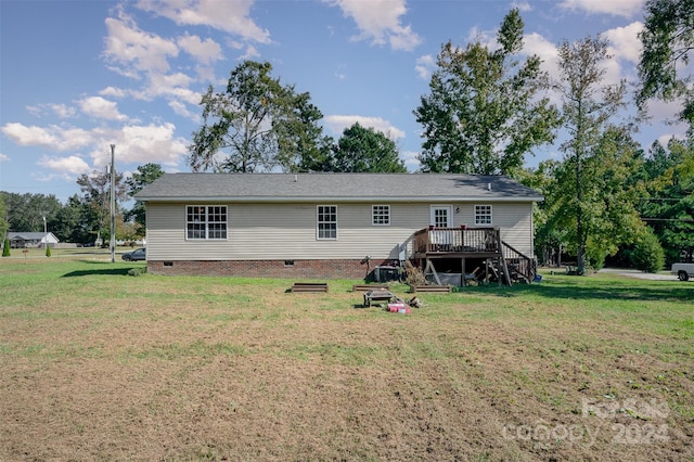 back of house featuring a lawn, stairway, a wooden deck, and crawl space
