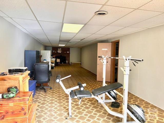 exercise area featuring a drop ceiling