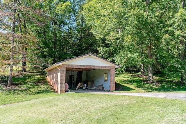 view of outdoor structure with a lawn