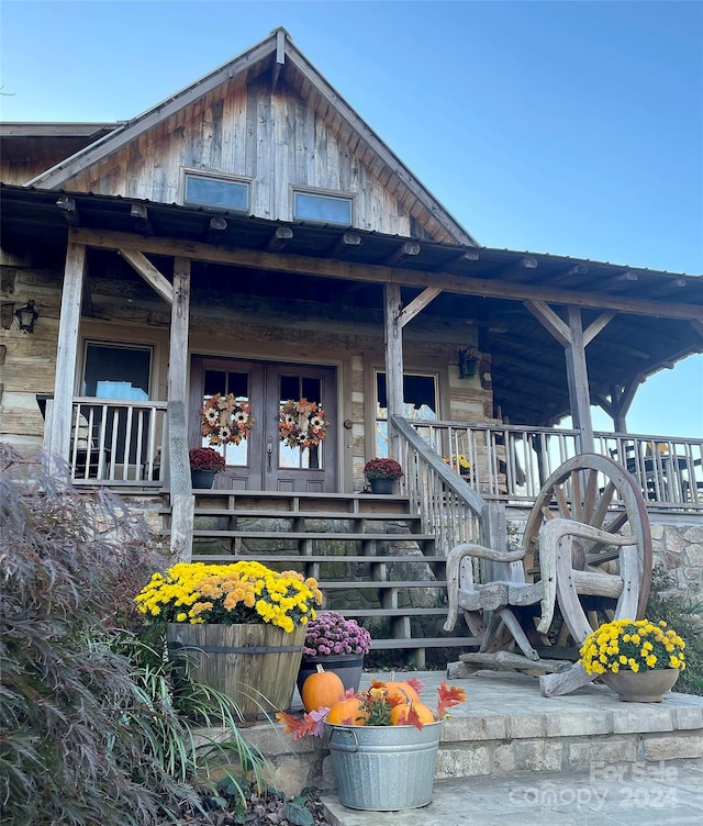 doorway to property with a porch