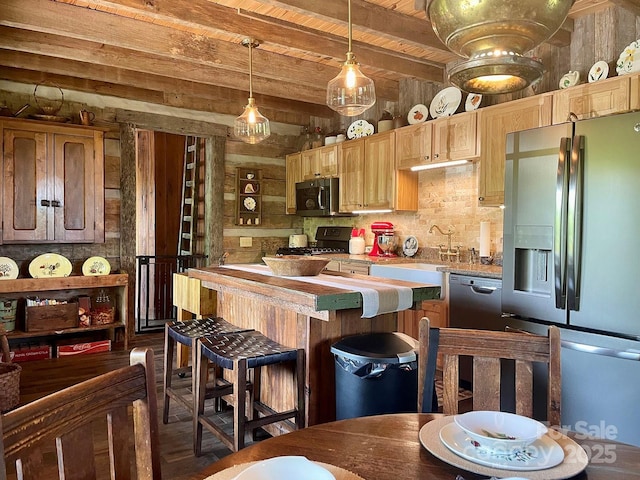 kitchen with beam ceiling, stainless steel appliances, tasteful backsplash, decorative light fixtures, and wooden ceiling