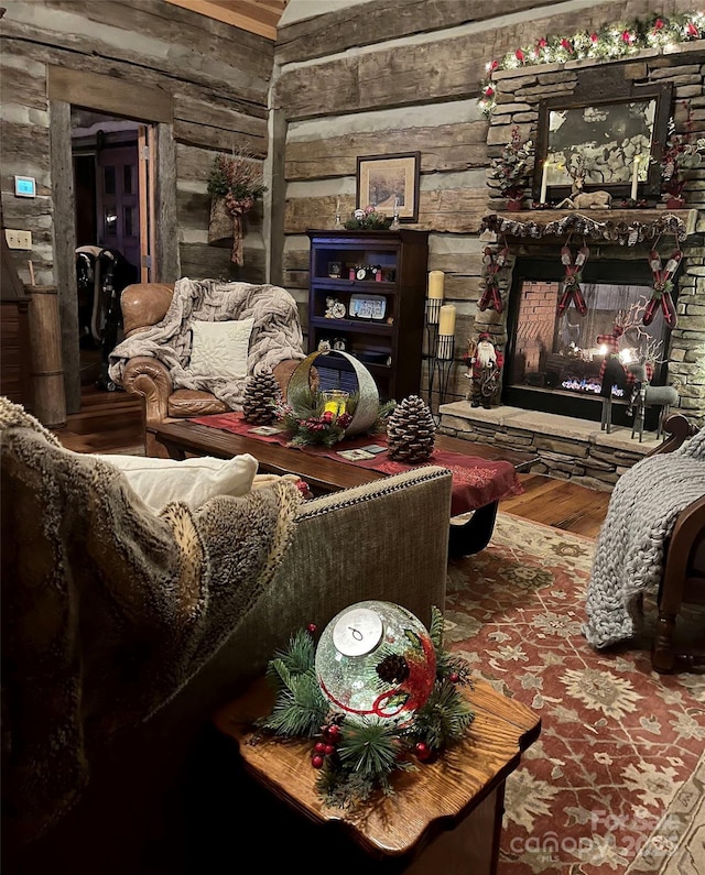 living area featuring hardwood / wood-style floors and a fireplace