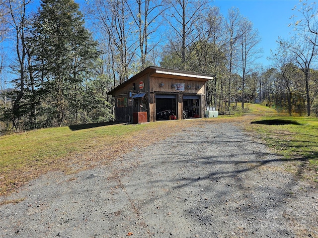 view of outbuilding with a yard