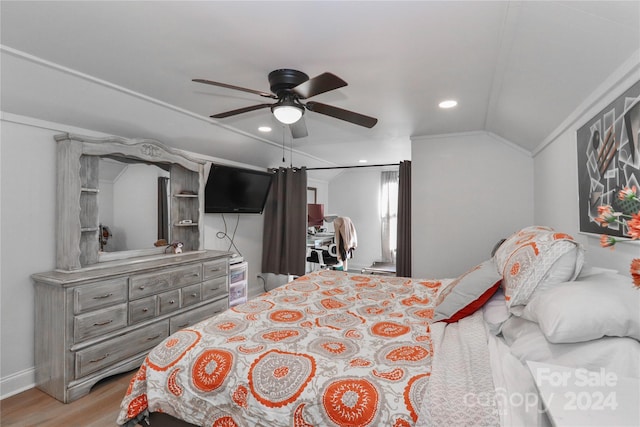 bedroom with ceiling fan, crown molding, vaulted ceiling, and light hardwood / wood-style floors