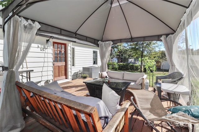 wooden terrace with a gazebo and an outdoor hangout area