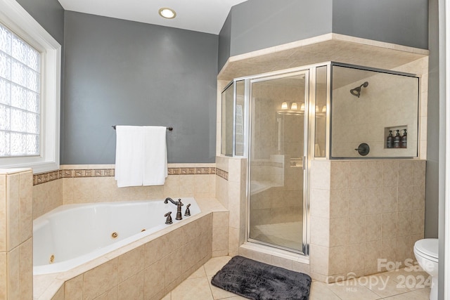 bathroom with independent shower and bath, toilet, and tile patterned floors