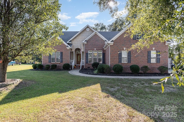 traditional-style house featuring crawl space, brick siding, and a front yard