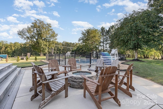 9404 Perimeter Ct, Zebulon, NC 27597 - view of patio / terrace with an outdoor fire pit and view of scattered trees