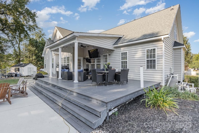 9404 Perimeter Ct, Zebulon, NC 27597 - wooden terrace with outdoor lounge area, a ceiling fan, a storage shed, and outdoor dining space