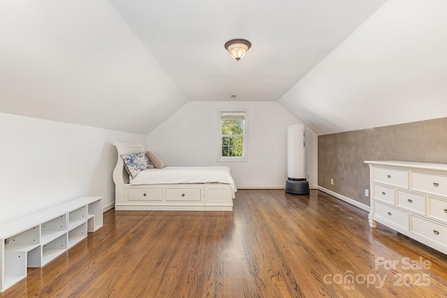 9404 Perimeter Ct, Zebulon, NC 27597 - bedroom with wood finished floors and vaulted ceiling