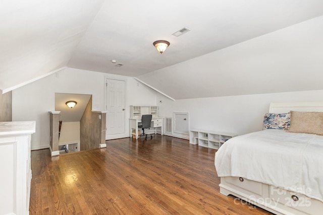 9404 Perimeter Ct, Zebulon, NC 27597 - bedroom with vaulted ceiling, wood finished floors, and an office area