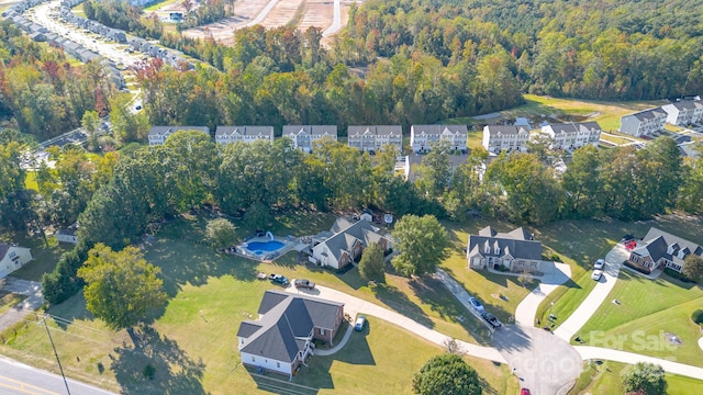 9404 Perimeter Ct, Zebulon, NC 27597 - aerial view of property's location with nearby suburban area and a heavily wooded area