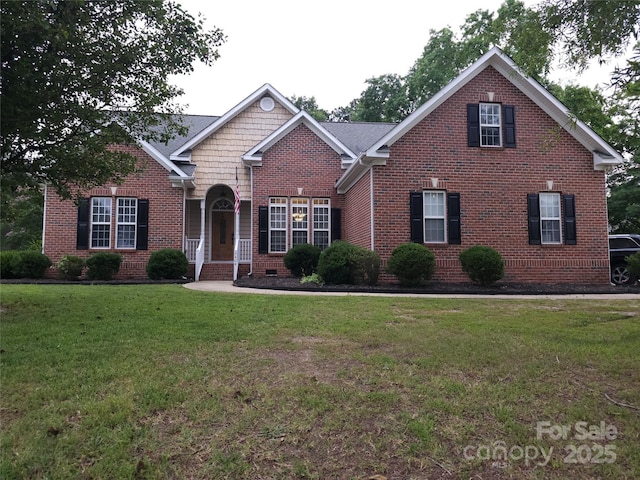 9404 Perimeter Ct, Zebulon, NC 27597 - traditional-style home with a front lawn and brick siding