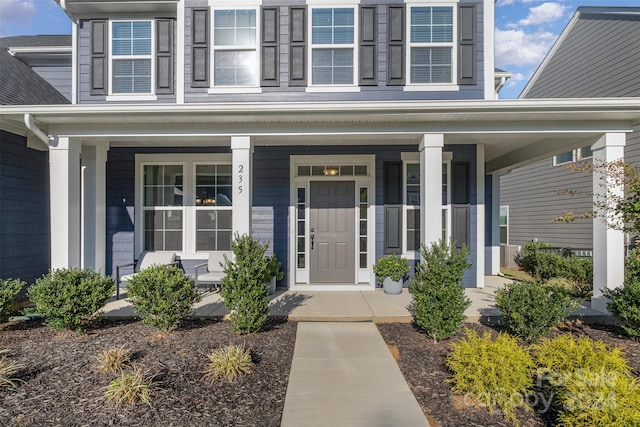 doorway to property with a porch