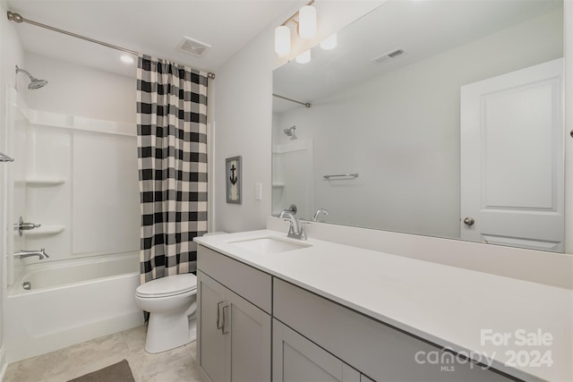 full bathroom featuring tile patterned flooring, vanity, shower / bath combo, and toilet