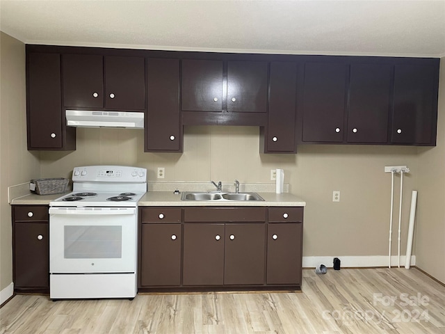 kitchen featuring white range with electric stovetop, dark brown cabinetry, sink, and light wood-type flooring