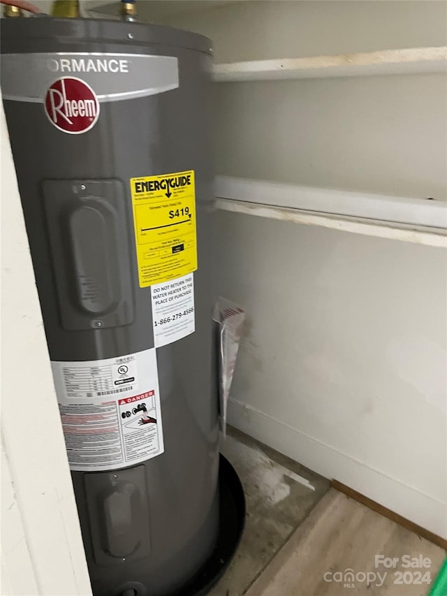 utility room featuring water heater