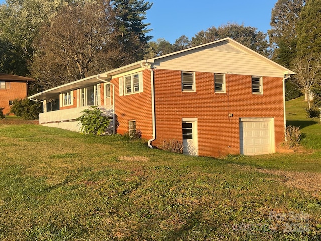 view of property exterior featuring a garage and a yard