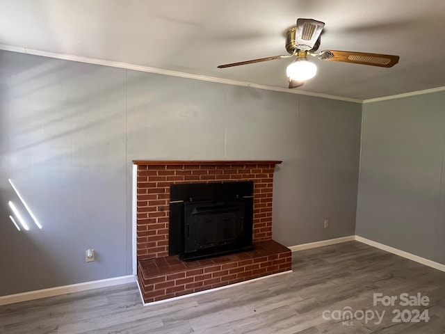 unfurnished living room with wood-type flooring, ornamental molding, and ceiling fan