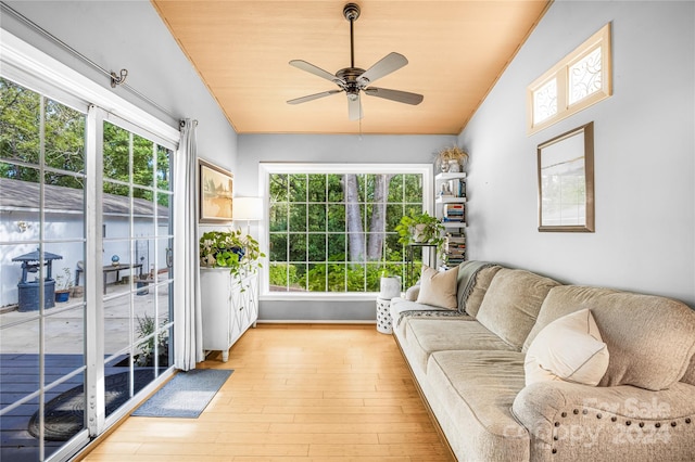 sunroom with a healthy amount of sunlight, ceiling fan, and vaulted ceiling