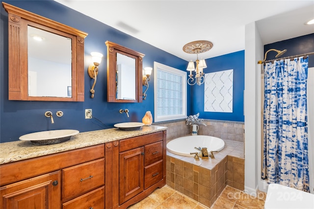 bathroom featuring vanity, plus walk in shower, a chandelier, and tile patterned floors