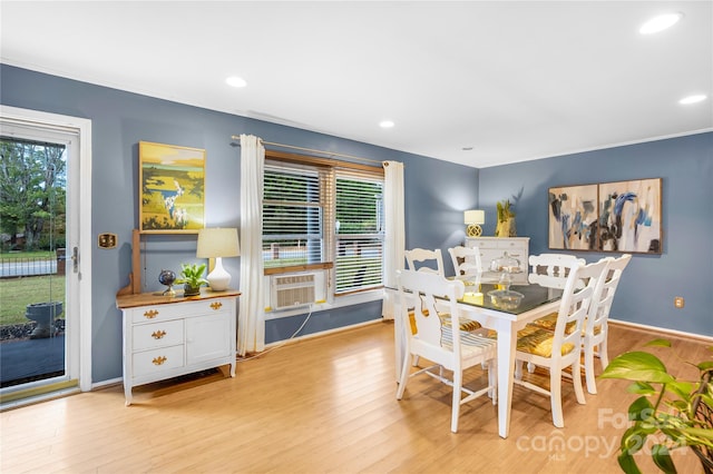 dining space with light hardwood / wood-style floors